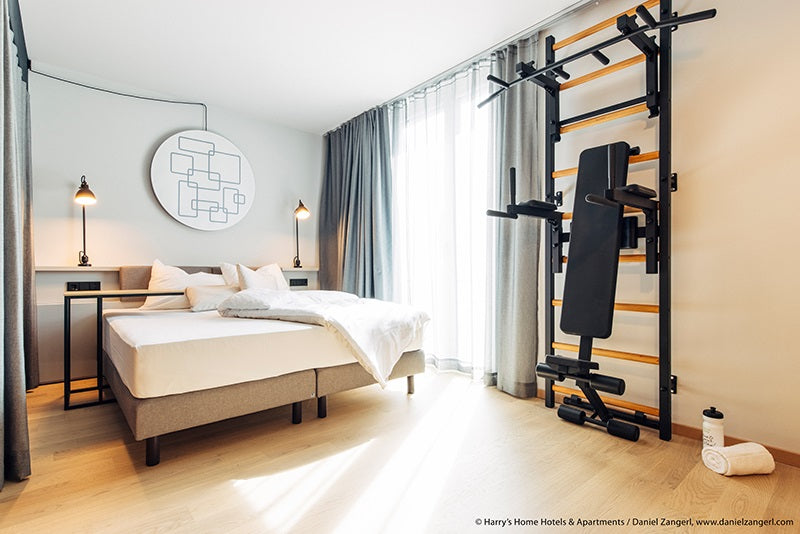 The 733B — pull-up bar, dip station, and bench on one wall.