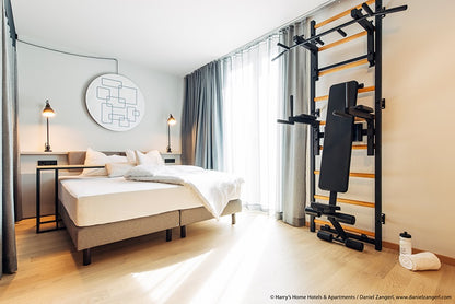 The 733B — pull-up bar, dip station, and bench on one wall.